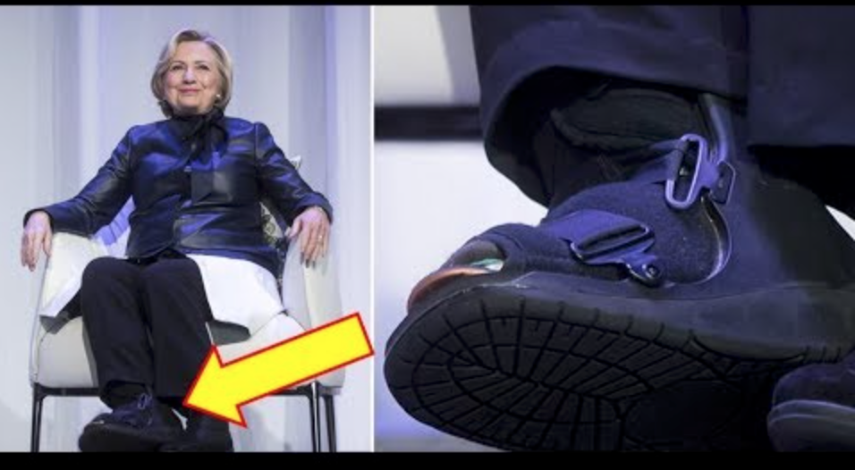 Hillary Clinton mit orthopädischem Schuh, der wahrscheinlich eine Fußfessel verbirgt